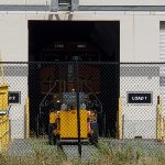 Close Up Shot of BNSF 3660, Transfer Dolly, and Bobcat.